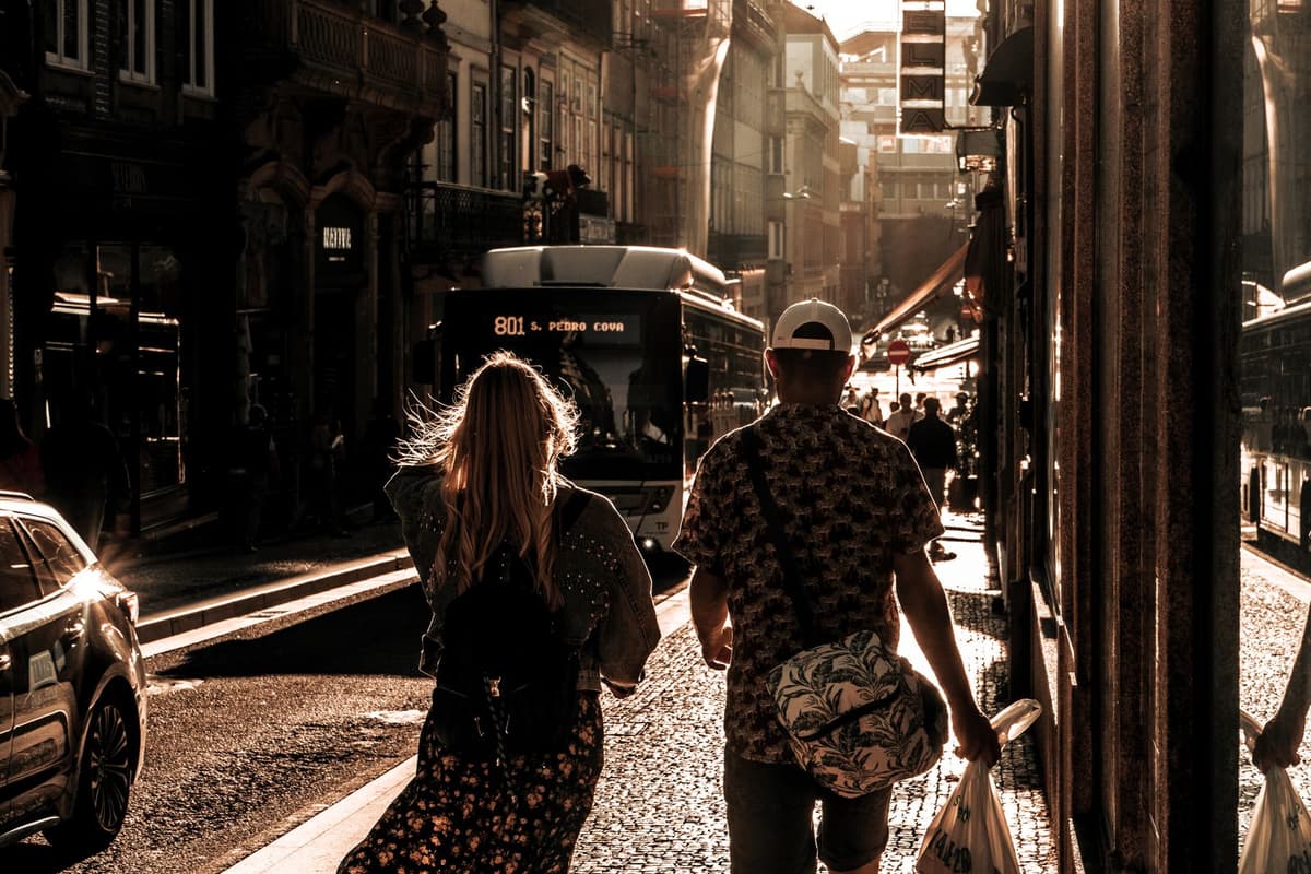 A couple walking beside a historic church